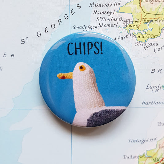 Jeff the Gull knitted seagull CHIPS! button badge with a blue background