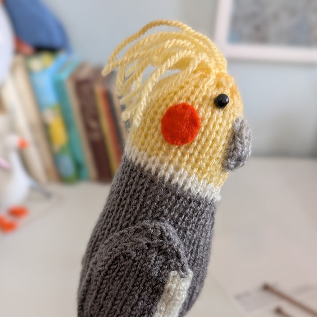a knitted cockatiel bird