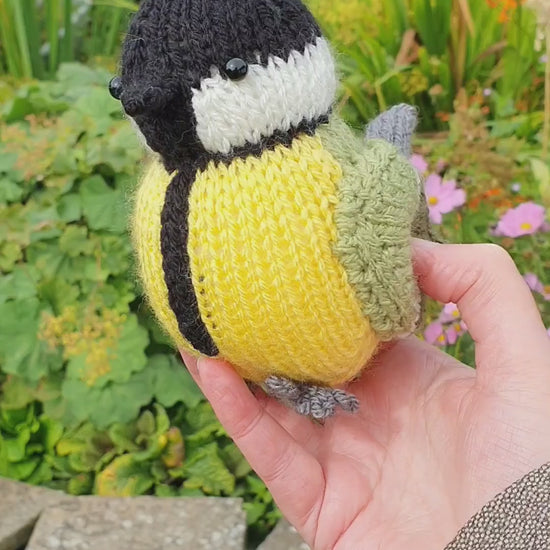 a knitted great tit in a Scottish garden